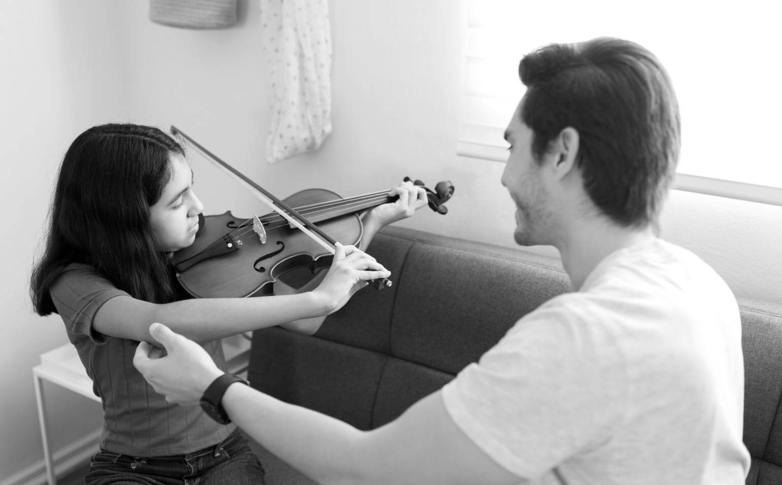this-is-right-position-happy-music-teacher-helping-motivated-preteen-girl-student-play-violin 1 - Northern Virginia Suzuki Violin Studio